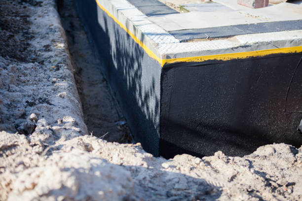 Professional Basement Waterproofing technician working in Lanoka Harbor, NJ